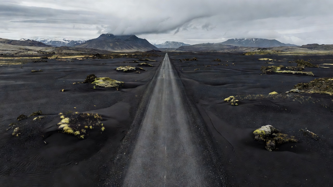 Icelandic highway cutting through volcanic black sand plains